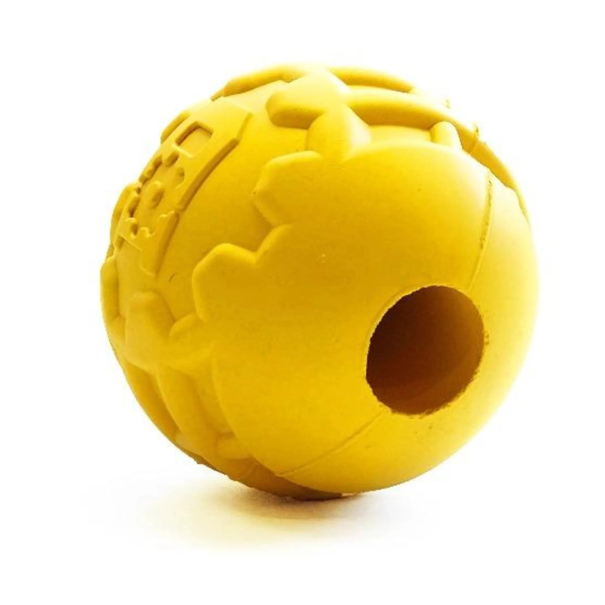 Side view of hollow yellow rubber dog ball with circular treat opening and textured grip