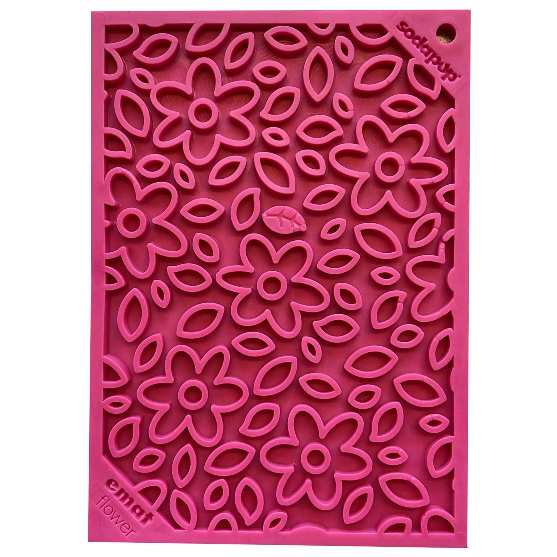 Close-up of pink textured floral lick mat surface detail