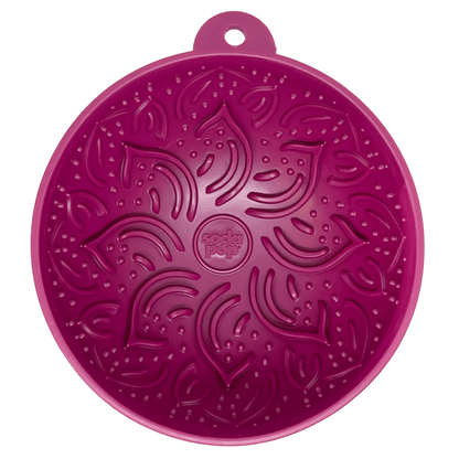 Magenta circular silicone lick mat featuring embossed leaf patterns and central logo