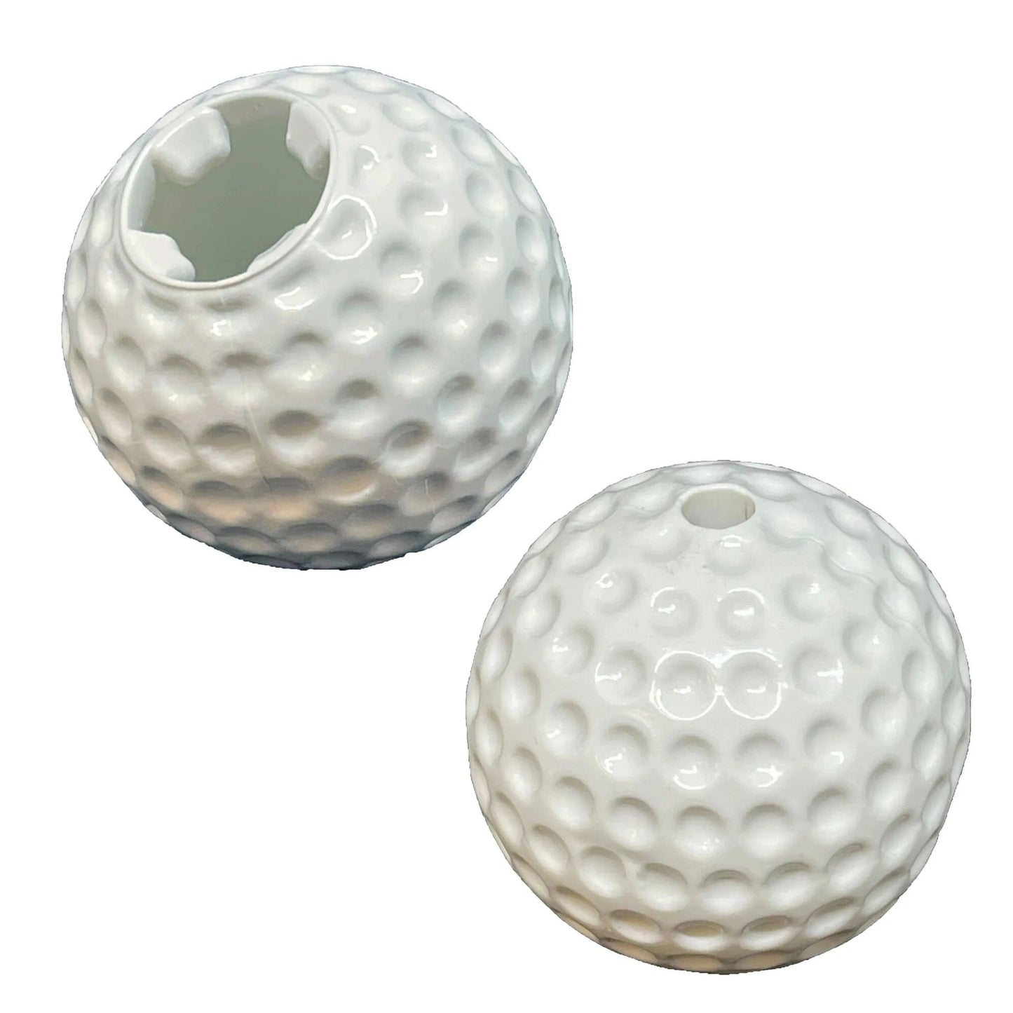 White golf ball dog toy showing hollow star-shaped interior and exterior treat hole