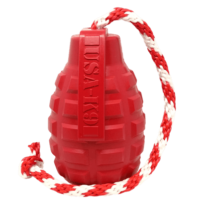 Red natural rubber grenade-shaped dog toy with textured grip and USA-K9 branding