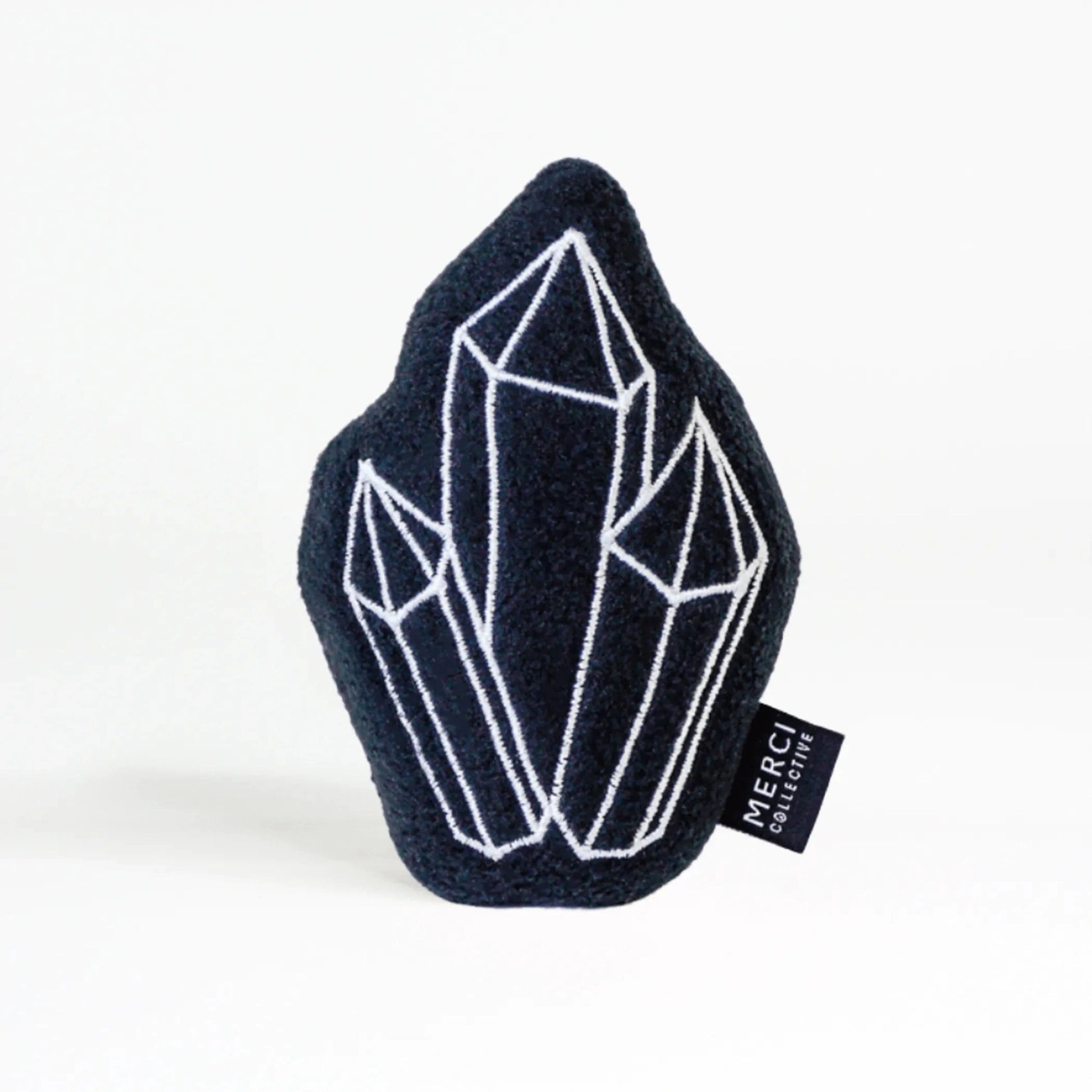 Navy blue plush crystal cat toy with embroidered details and Merci Collective tag