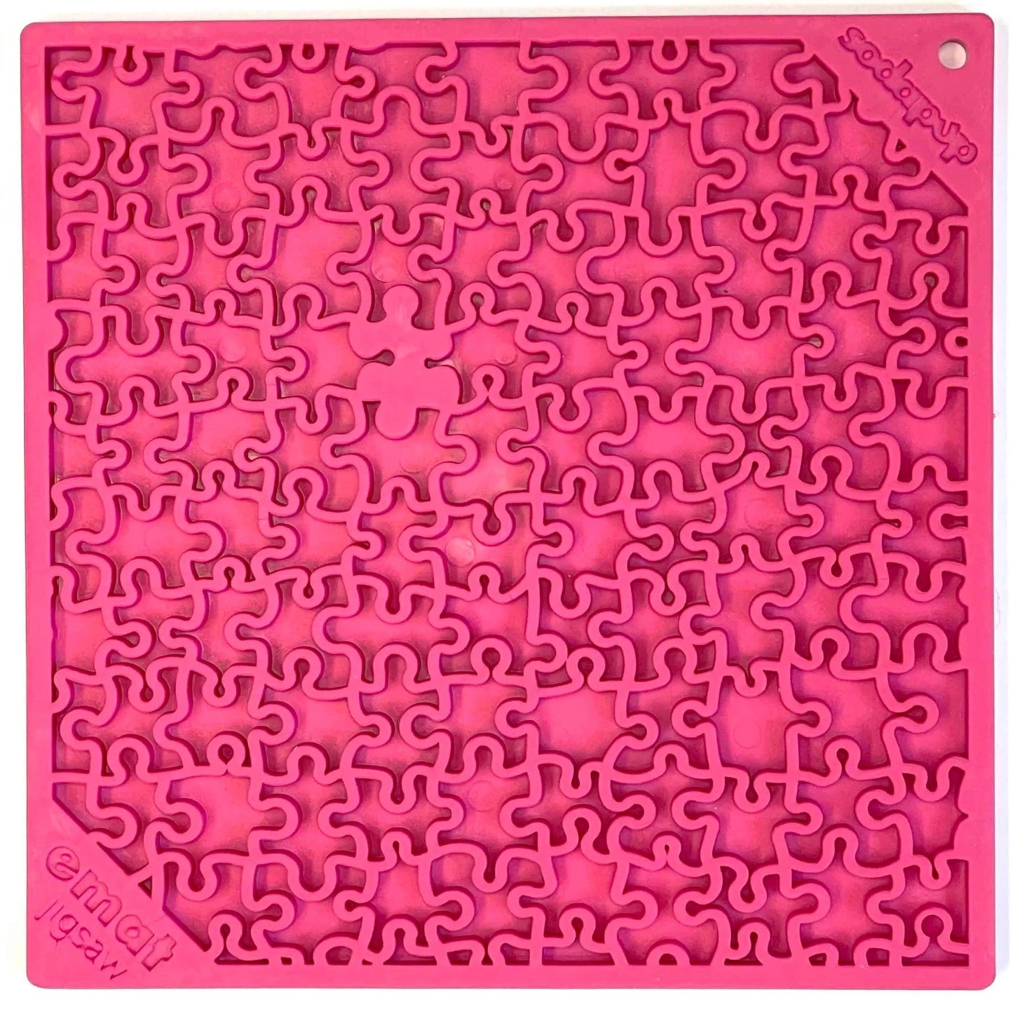 Bright pink jigsaw puzzle design lick mat close up