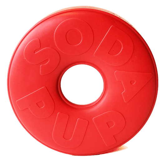 Top view of red SodaPup Life Ring rubber dog toy with embossed brand name on white background