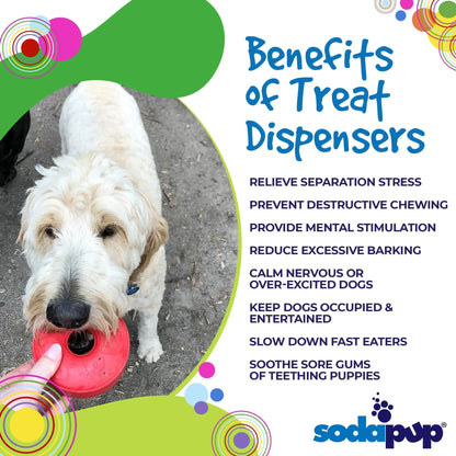 White fluffy dog chewing red SodaPup Life Ring treat dispenser outdoors for mental stimulation