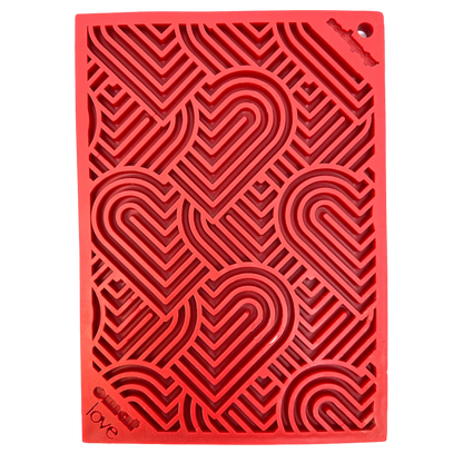 Close-up of red SodaPup heart pattern enrichment feeder maze channels