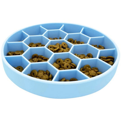 Mr. Peanut's light blue silicone slow feeder dog bowl with honeycomb grid filled with kibble