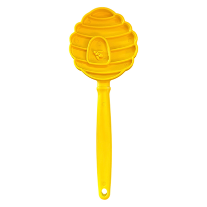 Yellow beehive shaped SodaPup lick stick with raised bee emblem and textured grooves