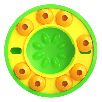 Green rimmed Piggy Poo puzzle feeder with flower-patterned center and orange cups