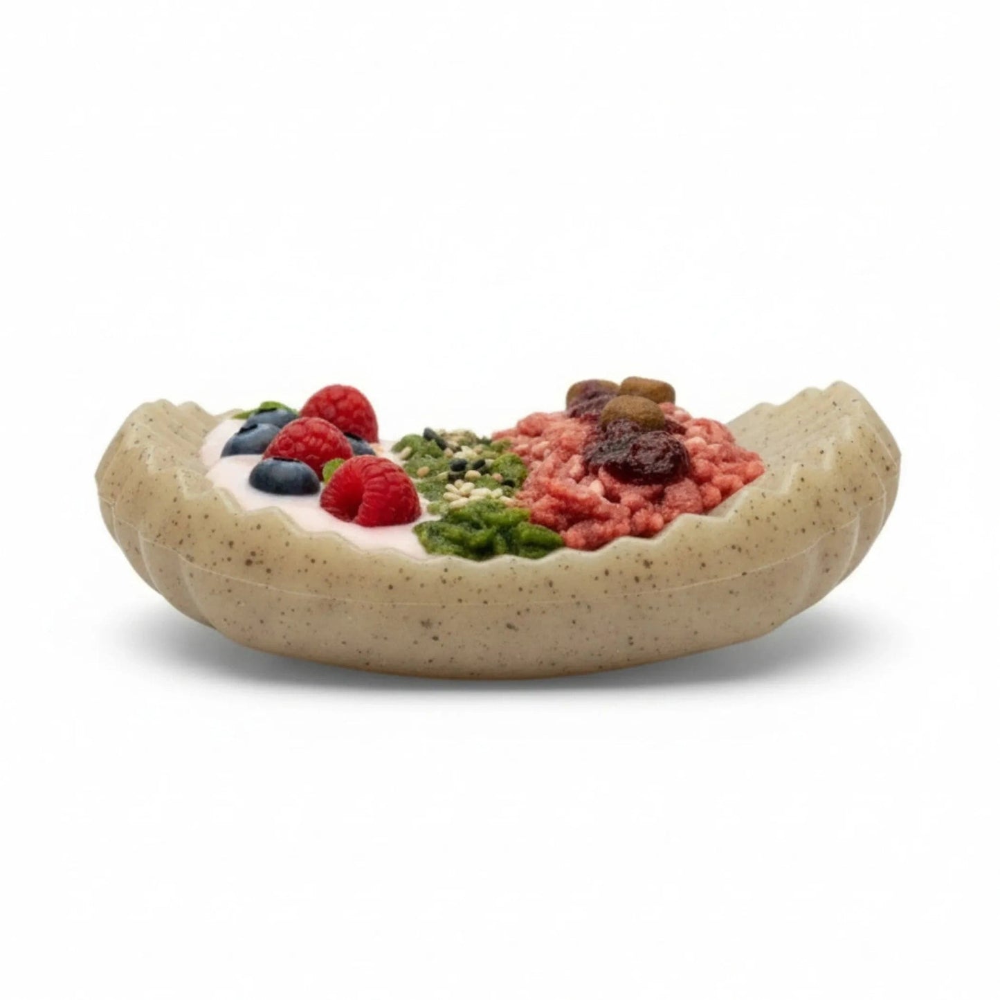 Side view of beige speckled nylon dog enrichment toy with food