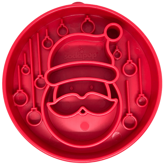 Top-down view of red circular Santa design slow feeder bowl with ornament barriers