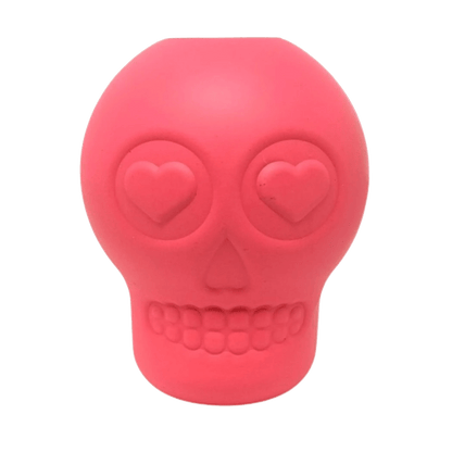 Pink sugar skull dog chew toy with treat cavity and heart eyes