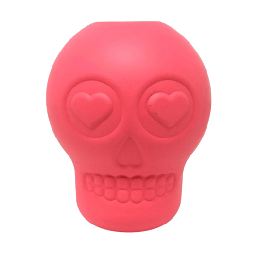 Pink sugar skull dog chew toy with treat cavity and heart eyes