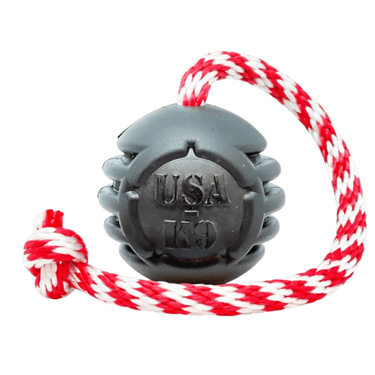 Black Stars and Stripes rubber dog chew toy with red white rope tug handle