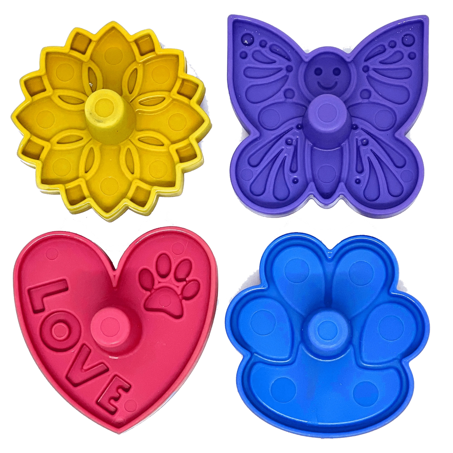 Four colorful plastic treat dispenser accessories featuring smiley butterfly, sunflower, heart with LOVE text, and paw shapes for upright freezing