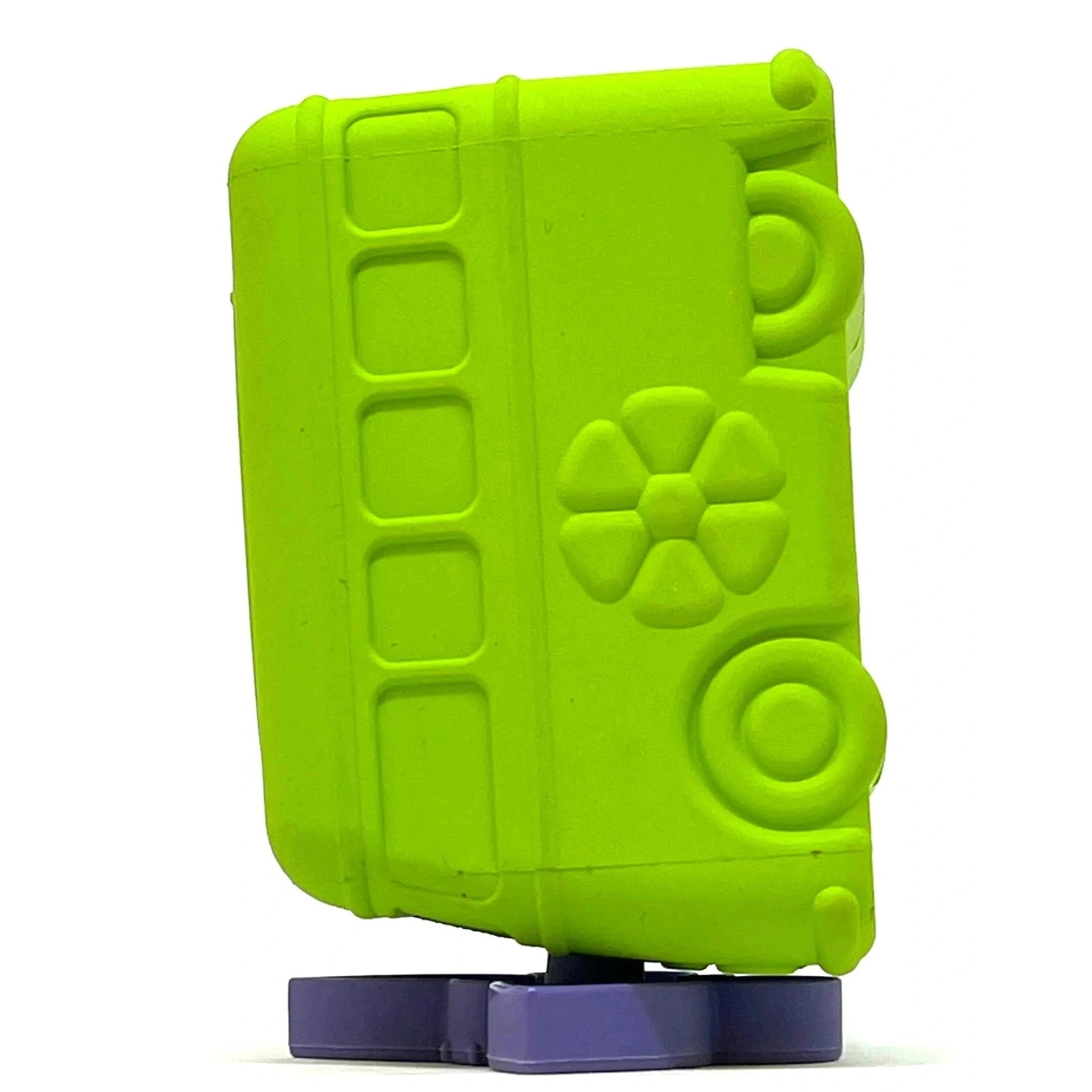 Lime green bus-shaped rubber dog toy displayed on a purple flower stand for stable vertical filling and freezing