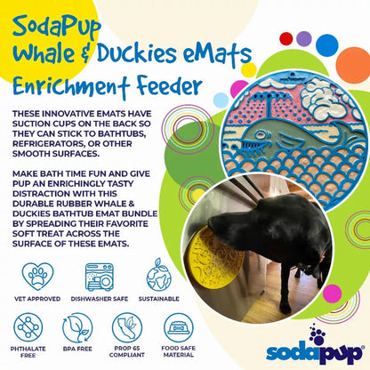 Black dog licking yellow duckies enrichment feeder mat on wooden floor