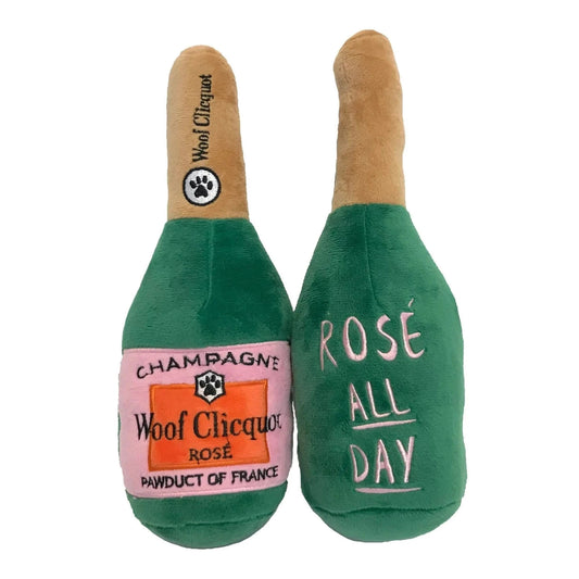Green Woof Clicquot Rosé plush dog toy with pink label and squeaker